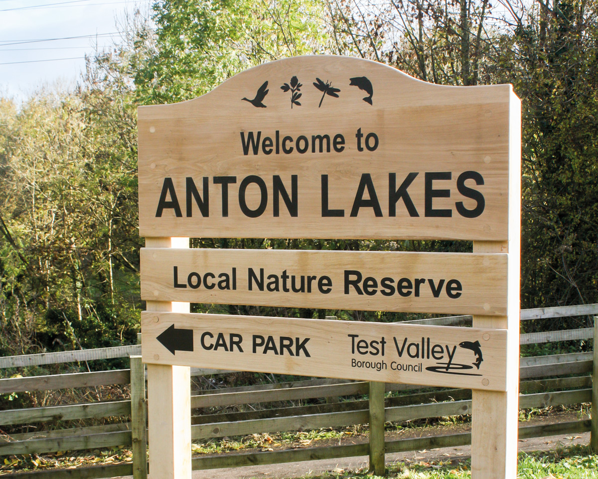 Wooden Ladder Sign made from English Oak with black infilled lettering and symbols and a fresh-sawn finish.