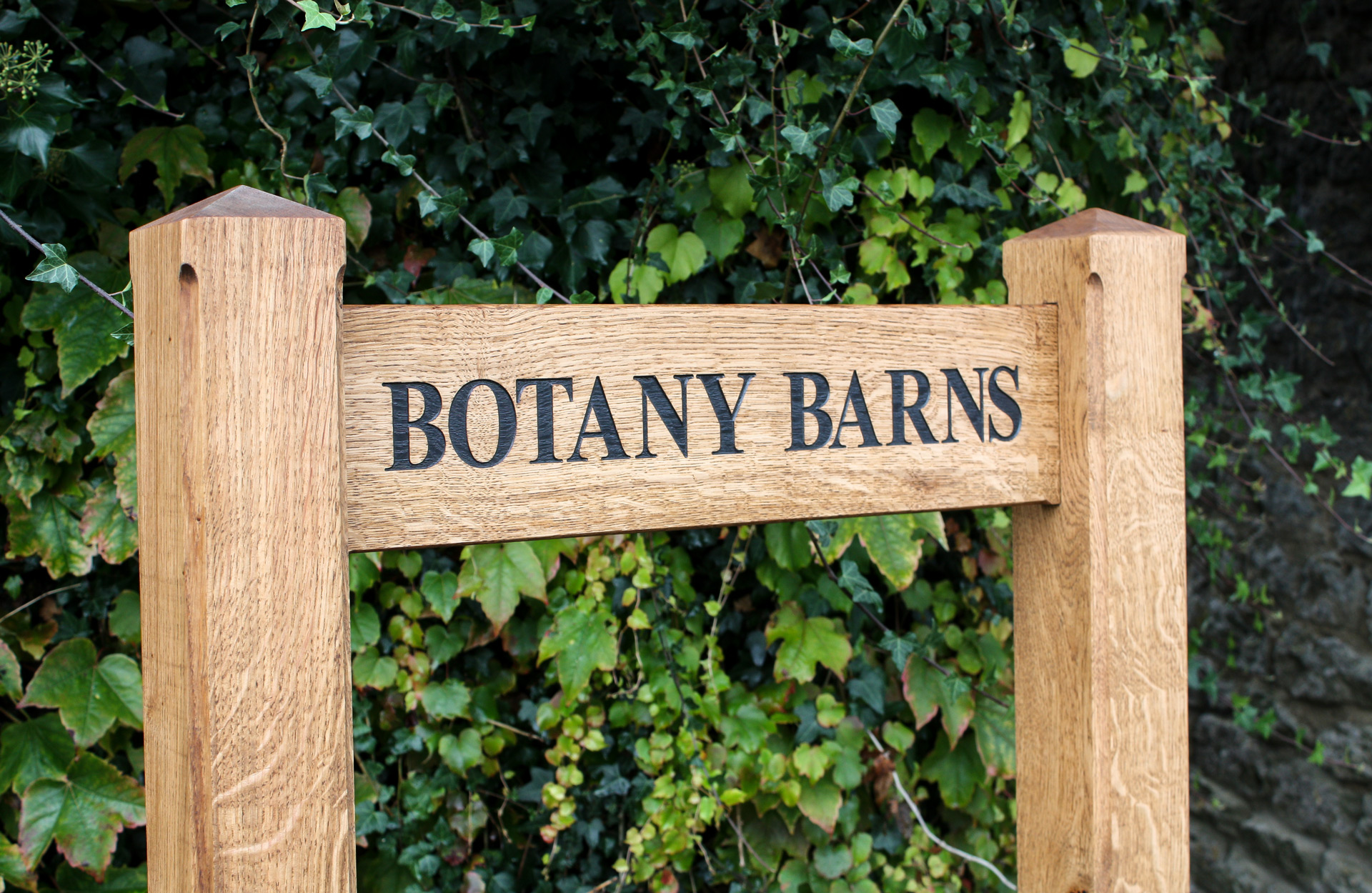 Wooden Ladder Sign made from FSC-Certified English Oak with engraved, black infilled lettering and an oiled surface finish.