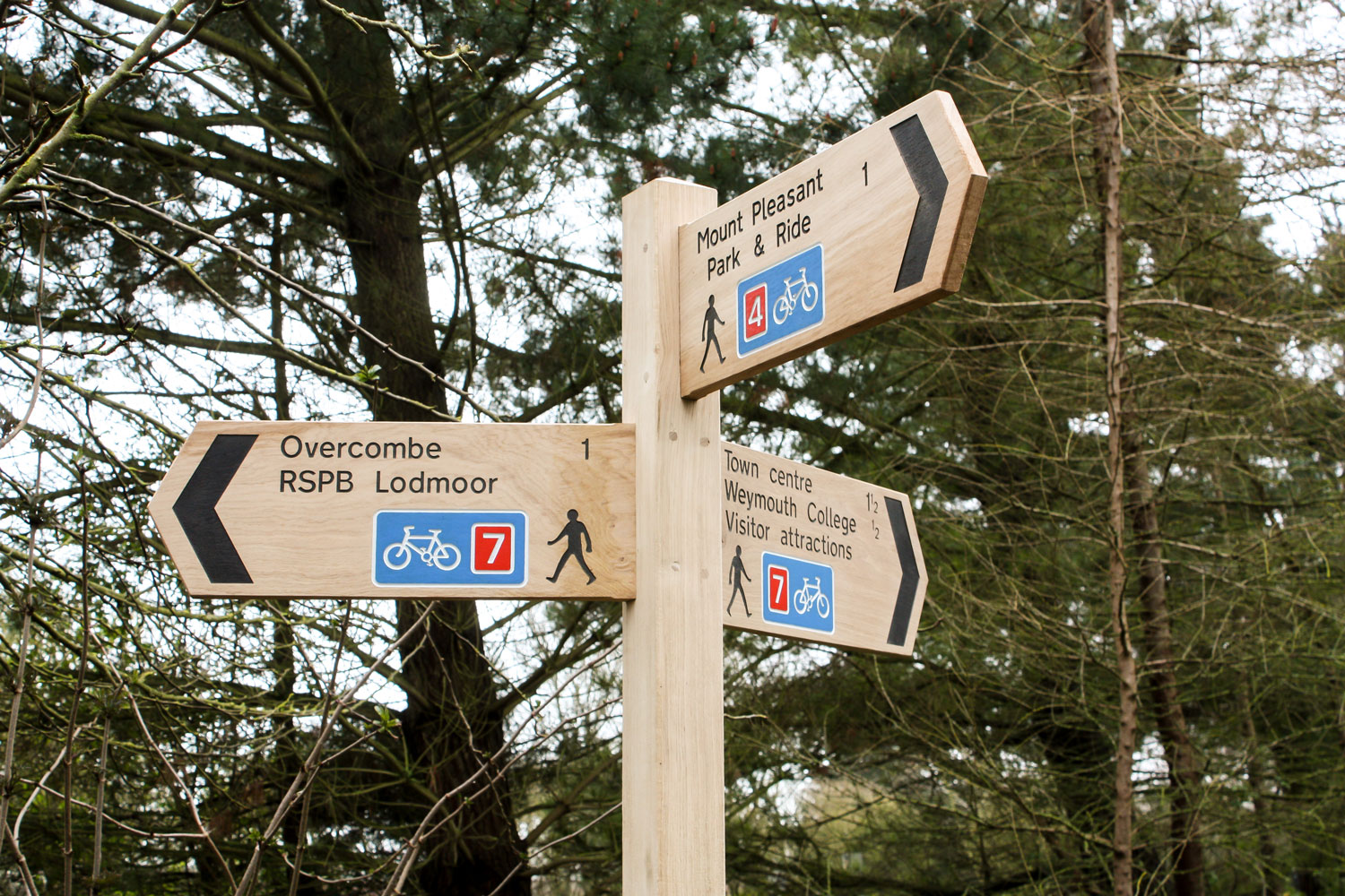 Wooden Fingerpost Sign made from English Oak with bespoke multi coloured symbol and lettering.