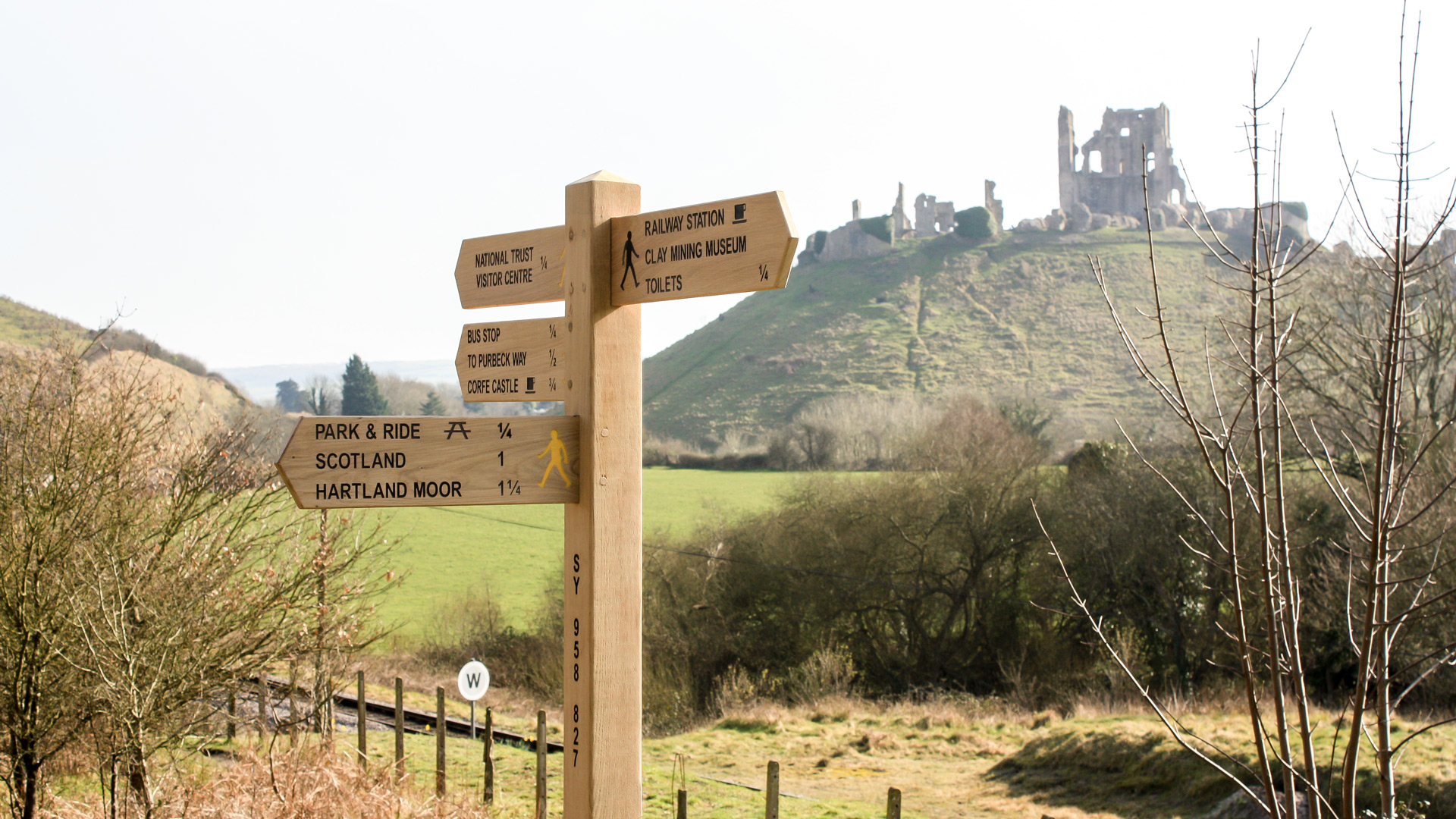 4-Arm Wooden Fingerpost Sign Post with black infilled engraved lettering and a smooth sanded natural surface finish.