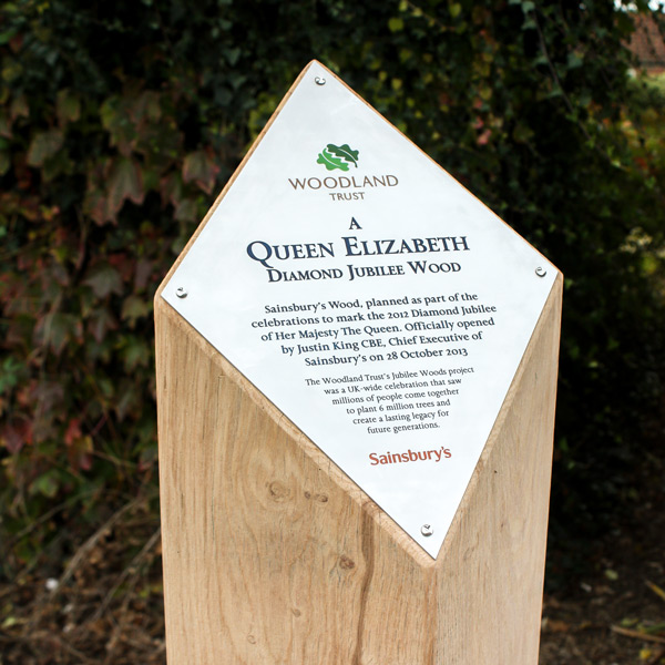Wooden Waymarker Sign Post with angled chevron top and etched metal interpretation plaque